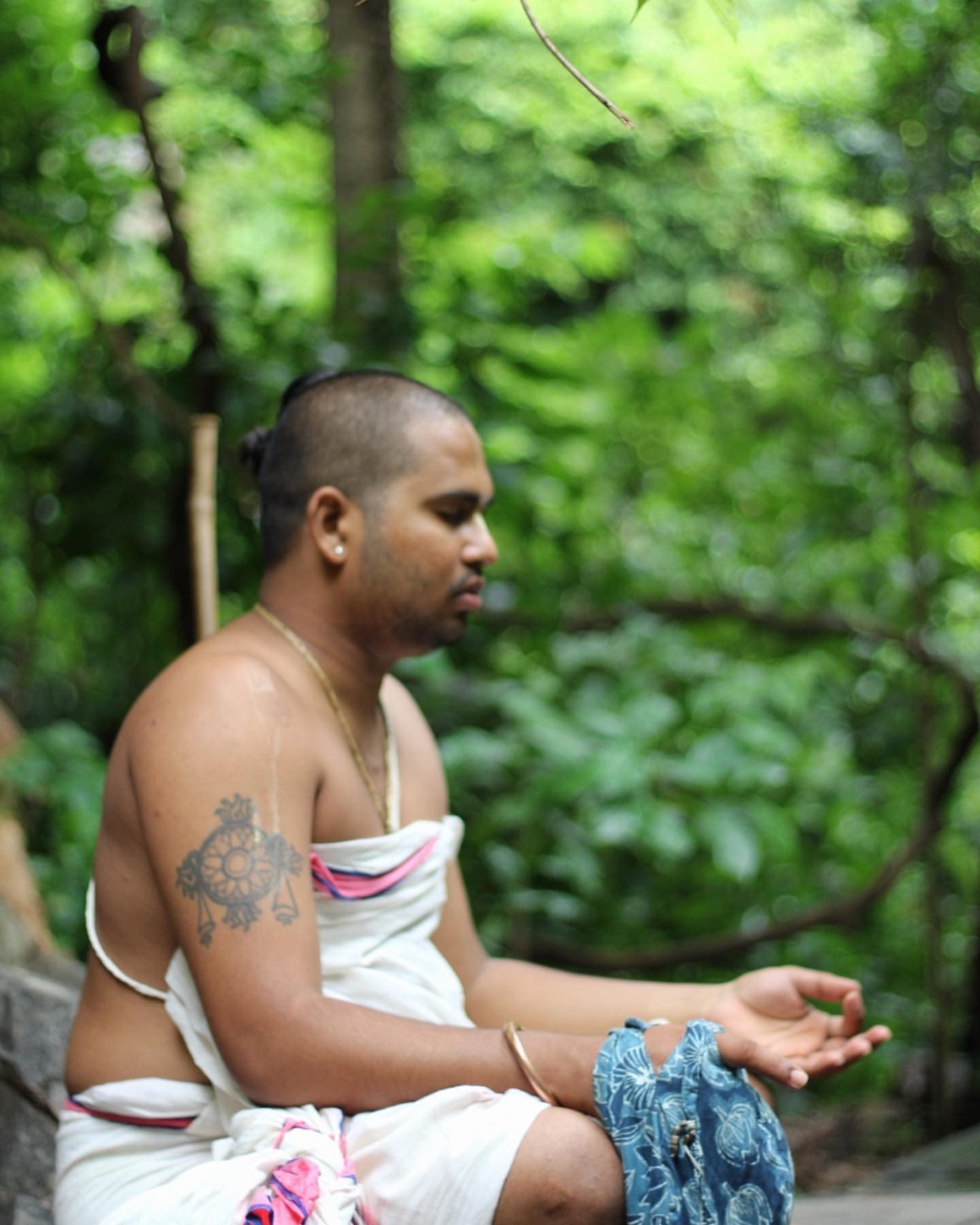 Pt. Praveen Sagar seated in meditation