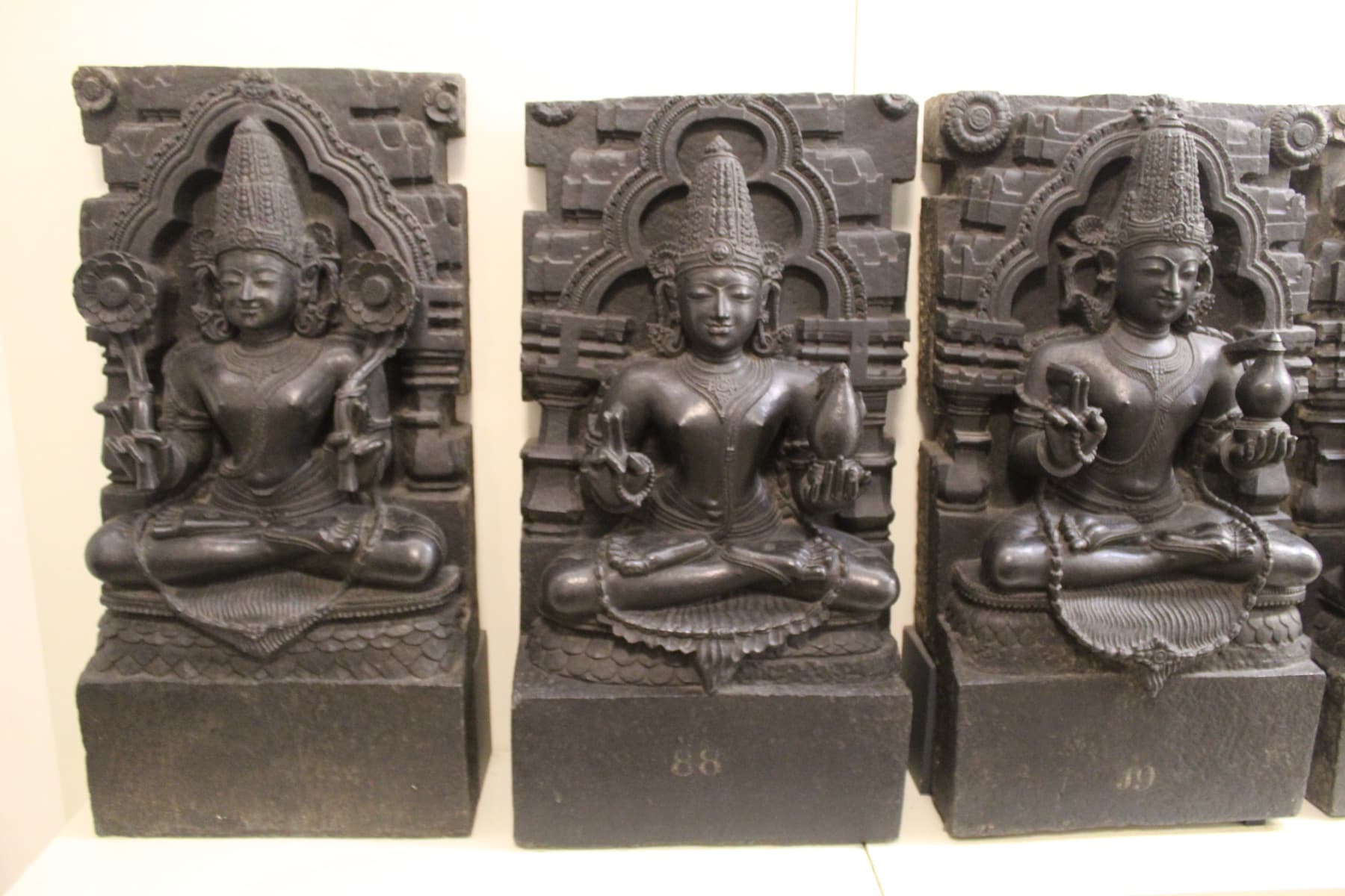 Black basalt panels of Surya, Soma and Mangala from a Navagraha set